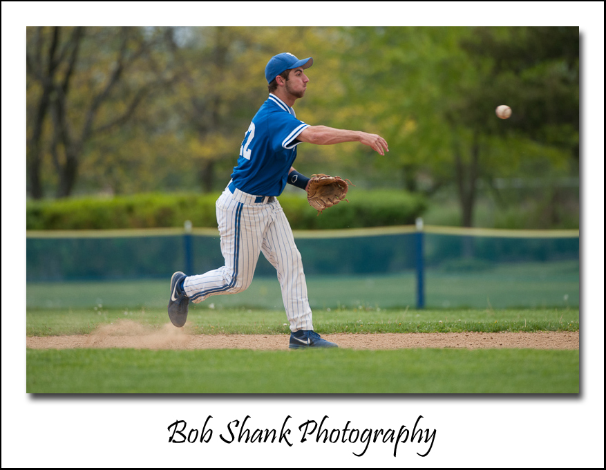 Second baseman, Austin Yoffredo, records the putout by throwing to first base.